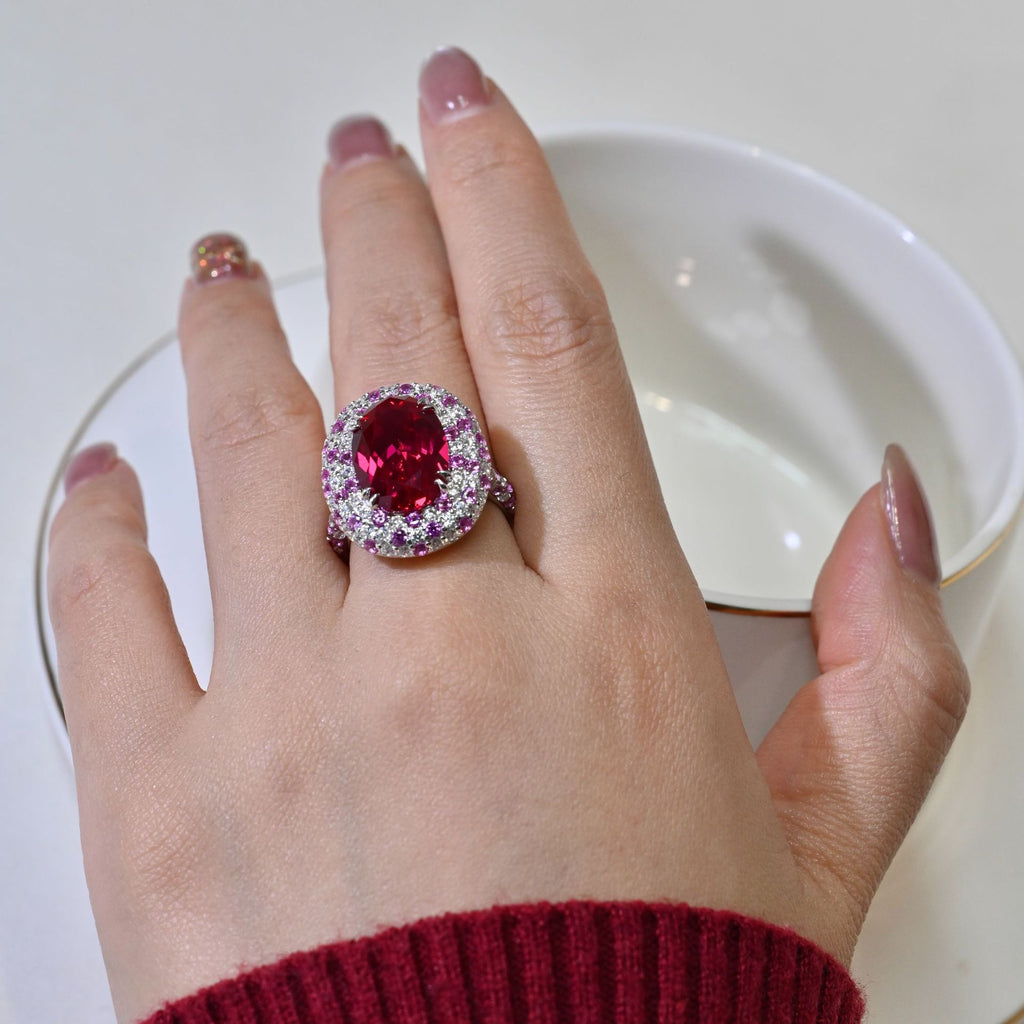 Ruby And Diamond-studded Oval Ring With A Pigeons-egg-shaped Center Stone
