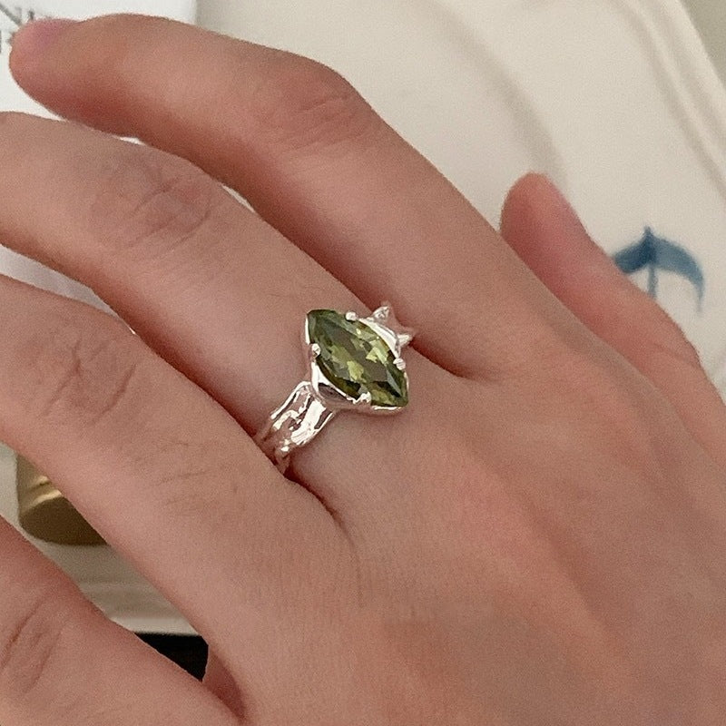 Olive Green Zircon Ring With An Irregular Textured Finish