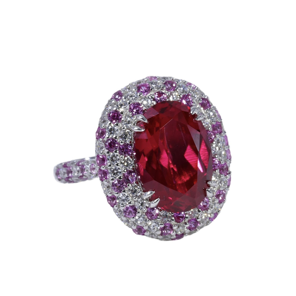 Ruby And Diamond-studded Oval Ring With A Pigeons-egg-shaped Center Stone