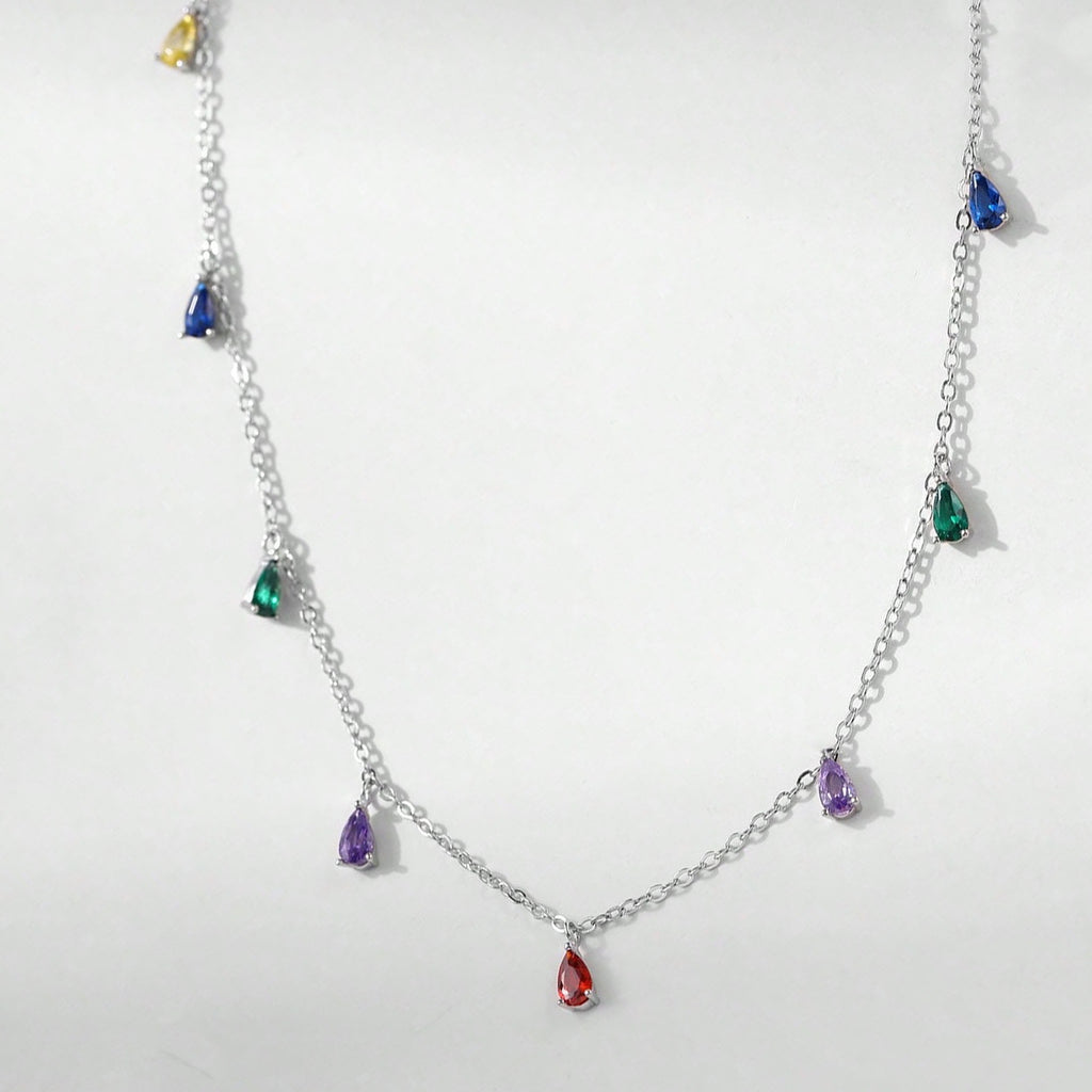 A Minimalist 925 Silver Necklace Featuring A Pendant With 9 Colorful Teardrop shaped Pendants