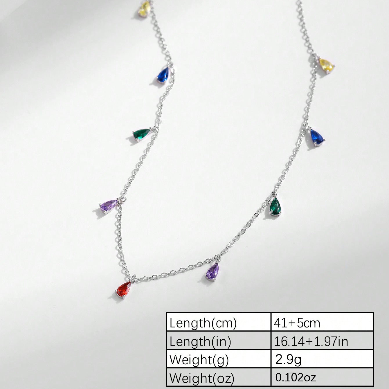 A Minimalist 925 Silver Necklace Featuring A Pendant With 9 Colorful Teardrop shaped Pendants