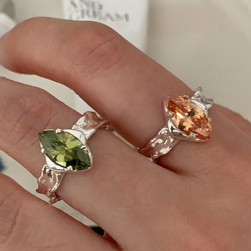 Olive Green Zircon Ring With An Irregular Textured Finish