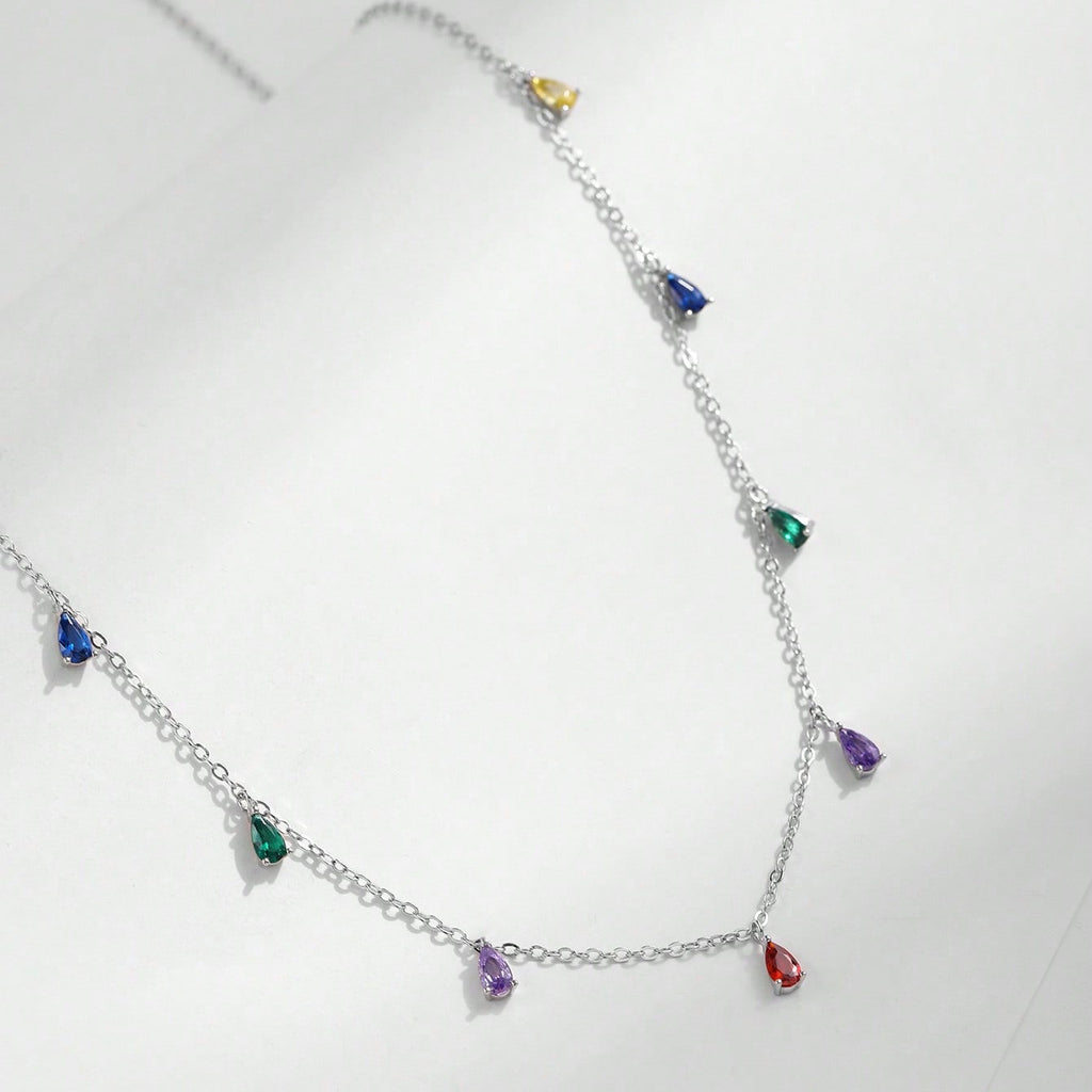 A Minimalist 925 Silver Necklace Featuring A Pendant With 9 Colorful Teardrop shaped Pendants