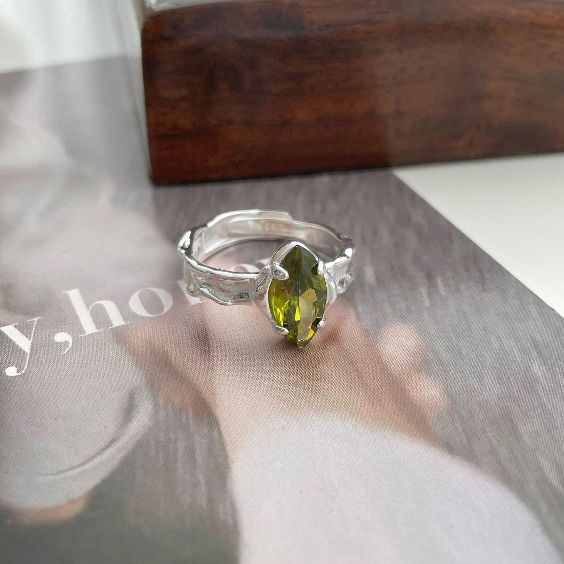 Olive Green Zircon Ring With An Irregular Textured Finish